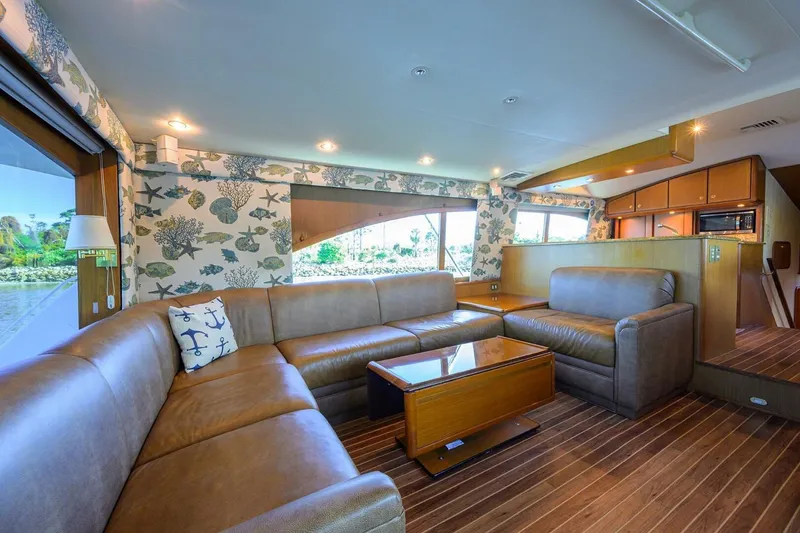 Slide: The Image of Luxurious interior of 2006 Ocean Yachts 57 Super Sport with leather seating and nautical decor. - 29