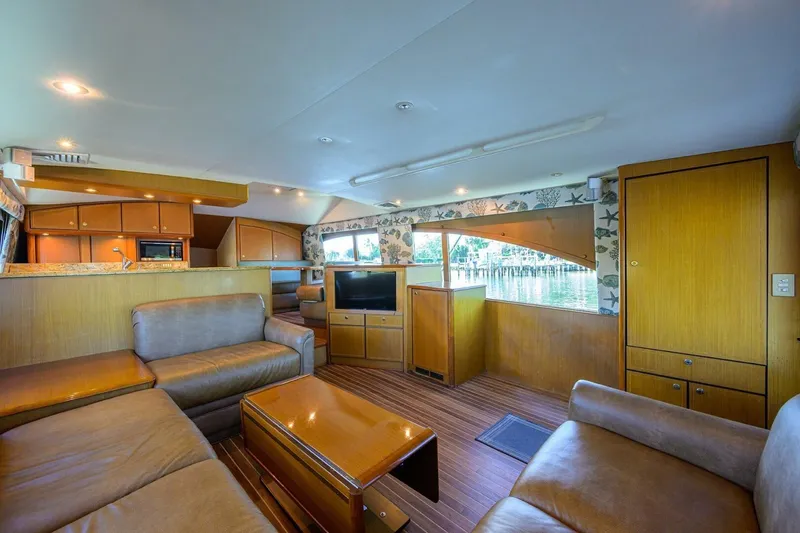 Slide: The Image of Luxurious interior of 2006 Ocean Yachts 57 Super Sport with leather seating and wood finishes. - 33