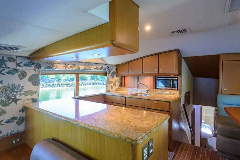 Slide: The Image of Luxurious kitchen interior of 2006 Ocean Yachts 57 Super Sport with granite countertops. - 36