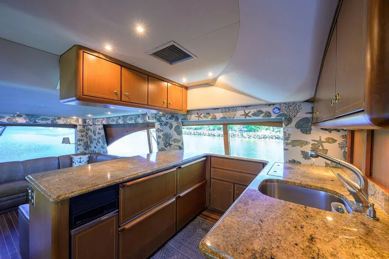 Slide: The Image of Luxurious interior of 2006 Ocean Yachts 57 Super Sport with elegant wood cabinetry. - 38