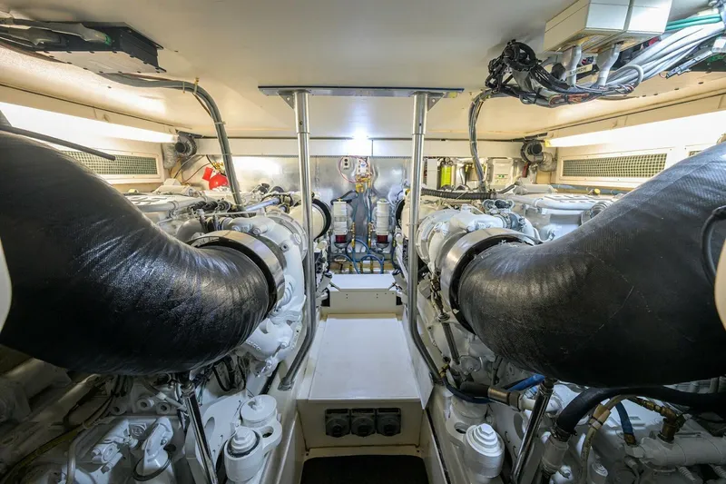 Slide: The Image of Engine room of 2006 Ocean Yachts 57 Super Sport, showcasing dual engines and mechanical systems. - 47