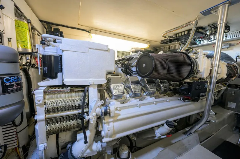Slide: The Image of Engine room of 2006 Ocean Yachts 57 Super Sport, showcasing powerful marine engine. - 51