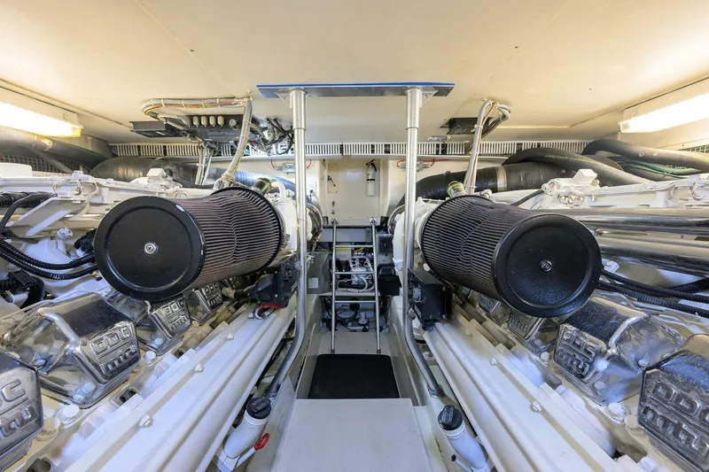 Slide: The Image of Engine room of 2006 Ocean Yachts 57 Super Sport, showcasing dual engines and mechanical components. - 53