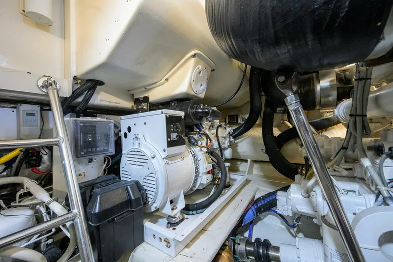 Slide: The Image of Engine room of 2006 Ocean Yachts 57 Super Sport, showcasing mechanical components and wiring. - 55