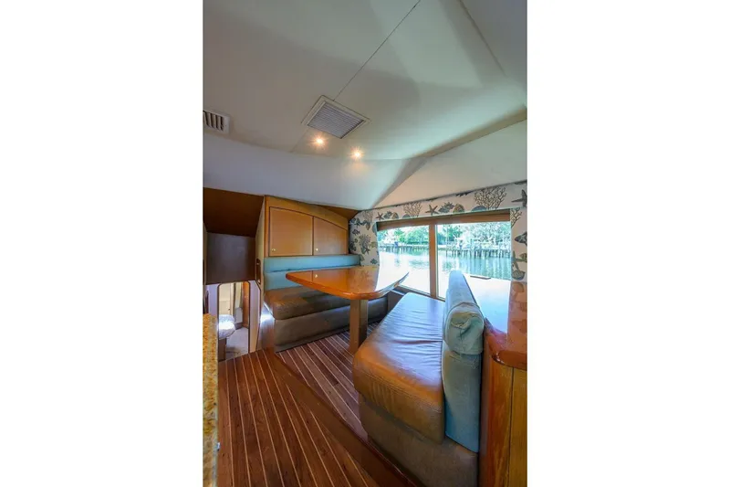 Slide: The Image of Interior of 2006 Ocean Yachts 57 Super Sport with cozy seating and large window view. - 34
