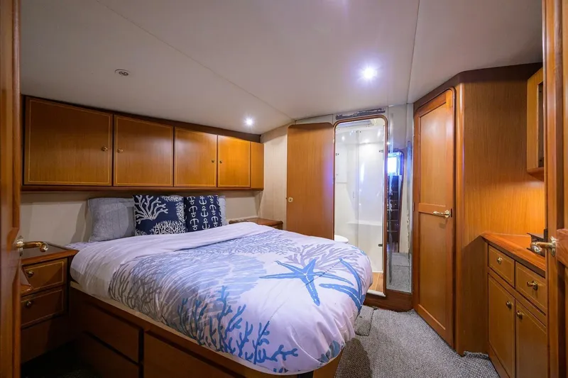 Slide: The Image of Luxurious cabin interior of 2006 Ocean Yachts 57 Super Sport with elegant wood finish. - 39