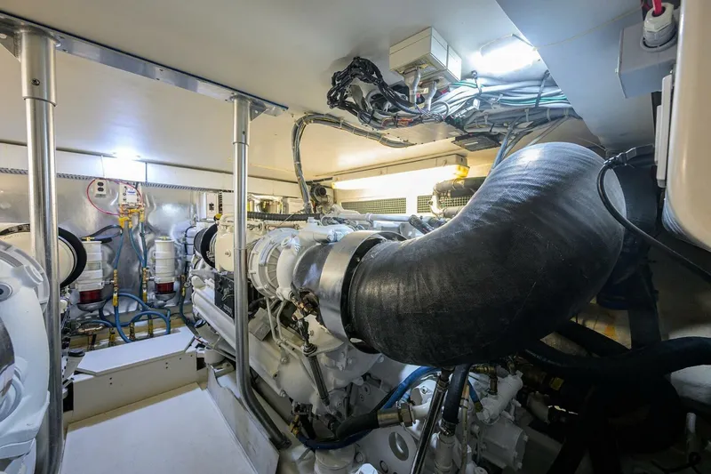 Slide: The Image of Engine room of 2006 Ocean Yachts 57 Super Sport, showcasing mechanical components and wiring. - 48