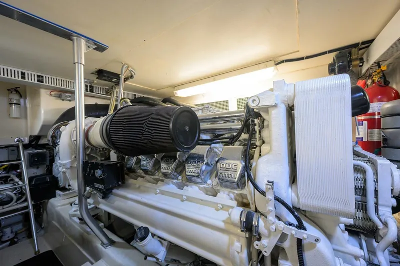 Slide: The Image of Engine room of 2006 Ocean Yachts 57 Super Sport, showcasing powerful marine engine. - 52