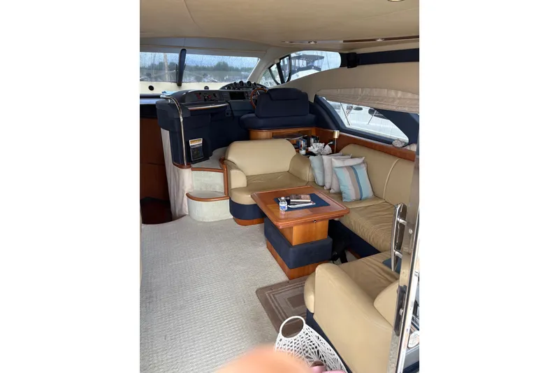 Slide: The Image of Luxurious interior of 2005 Azimut Fly 50 yacht with elegant seating and helm station. - 14