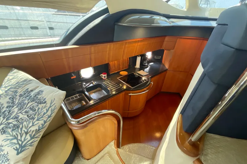 Slide: The Image of Luxurious 2005 Azimut Fly 50 yacht interior with modern kitchen and elegant wood finishes. - 19