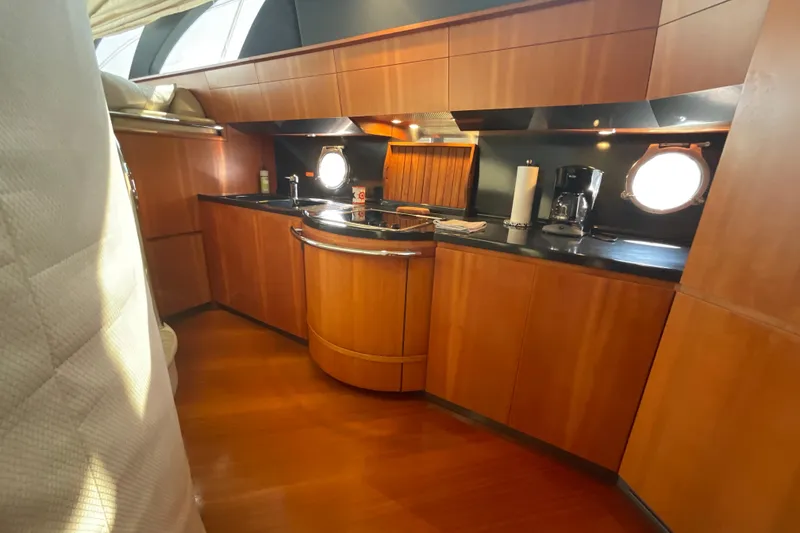 Slide: The Image of Luxurious kitchen interior of 2005 Azimut Fly 50 yacht with wooden cabinetry and modern appliances. - 20