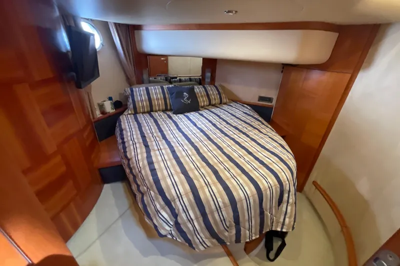 Slide: The Image of Luxurious cabin interior of 2005 Azimut Fly 50 yacht with striped bedding. - 21