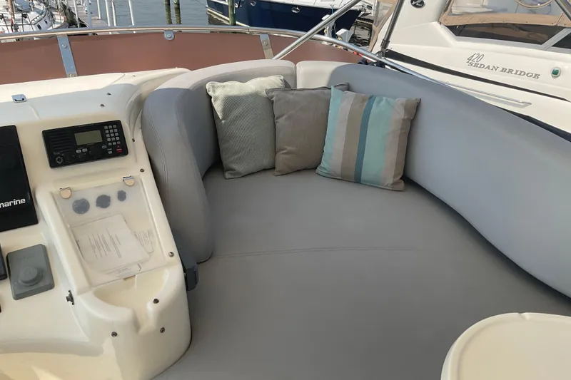 Slide: The Image of Luxurious seating area on 2005 Azimut Fly 50 yacht with cushions and control panel. - 30