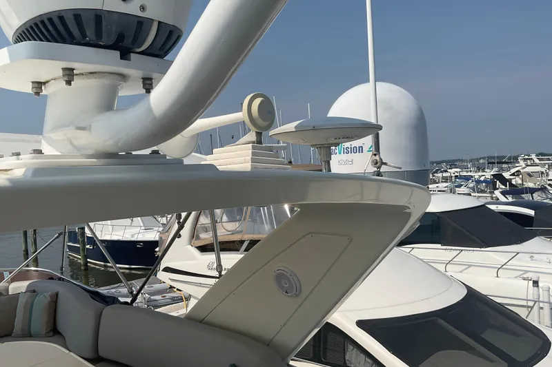 Slide: The Image of 2005 Azimut Fly 50 yacht with radar equipment, docked at a marina. - 39