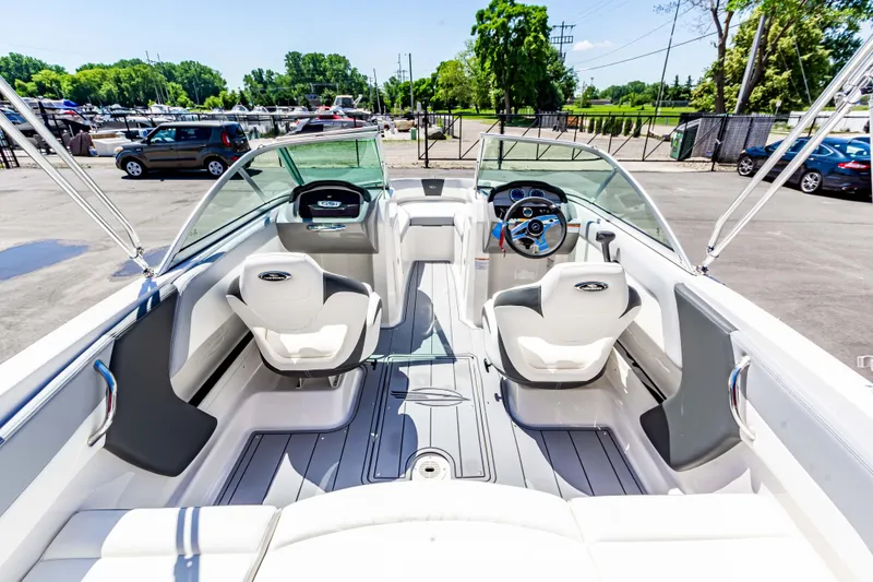 Slide: The Image of 2024 Chaparral 19 SSi OB boat interior with modern seating and dashboard. - 11