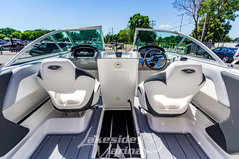 Slide: The Image of 2024 Chaparral 19 SSi OB boat interior with modern seating and steering wheel. - 18