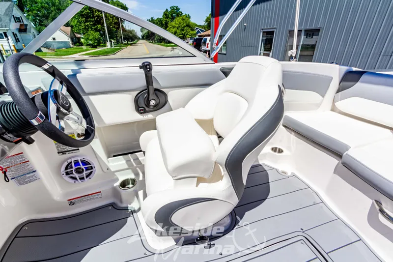 Slide: The Image of 2024 Chaparral 19 SSi OB boat interior with steering wheel and seating. - 22
