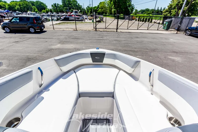 Slide: The Image of 2024 Chaparral 19 SSi OB boat interior storage compartment with cushioned seating. - 28
