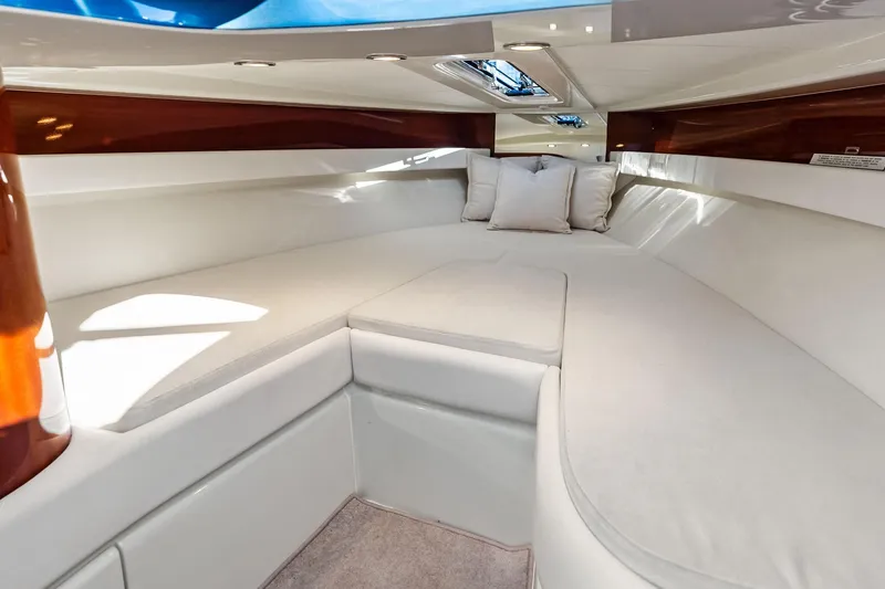Slide: The Image of Luxurious interior cabin of 2013 Riva 33 Aquariva with plush white seating. - 19