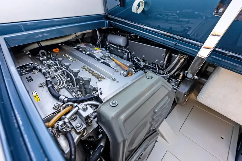 Slide: The Image of Engine compartment of 2013 Riva 33 Aquariva, showcasing Yanmar engine components. - 17