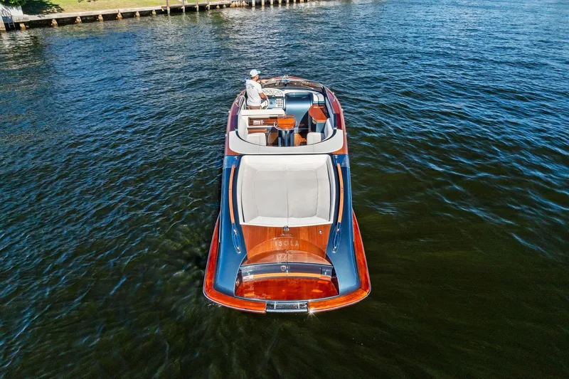 Slide: The Image of 2013 Riva 33 Aquariva luxury boat cruising on a serene lake. - 3