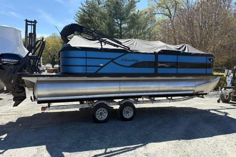 The Image of 2026 Bentley Pontoons Legacy 223 Navigator on trailer, covered and parked outdoors. - 0