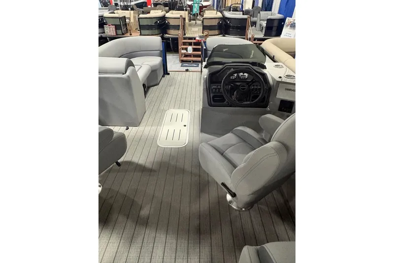 Slide: The Image of 2026 Bentley Pontoons Legacy 223 Navigator interior with modern seating and steering console. - 3