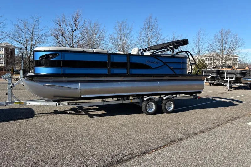 Slide: The Image of 2026 Bentley Pontoons Legacy 223 Navigator on trailer in parking lot. - 7