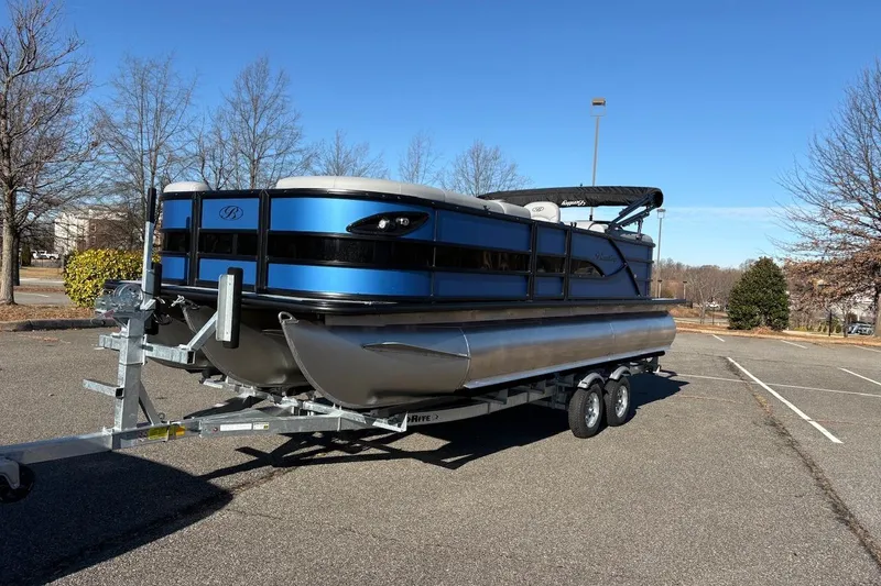 Slide: The Image of 2026 Bentley Pontoons Legacy 223 Navigator on trailer in parking lot. - 8