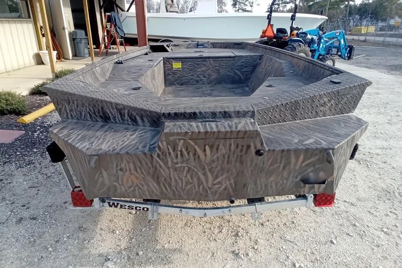 Slide: The Image of 2026 Alweld 1552 Invader boat with camouflage design on a Wesco trailer. - 12