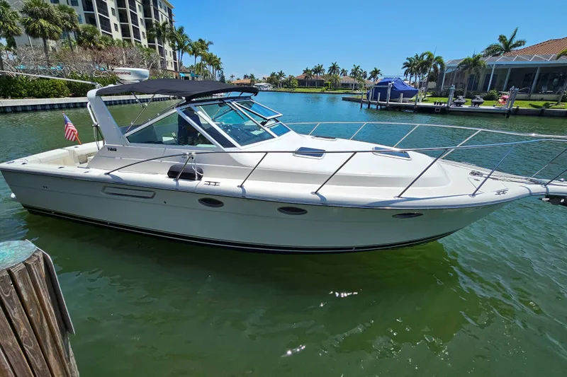 The Image of 2001 Tiara Yachts 3100 Open boat docked in sunny marina setting. - 0
