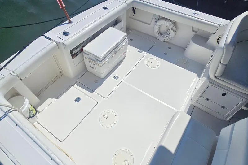 Slide: The Image of 2001 Tiara Yachts 3100 Open boat deck with seating and storage compartments. - 13