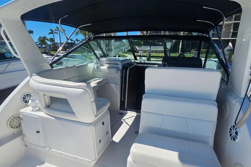Slide: The Image of 2001 Tiara Yachts 3100 Open interior with white seating and helm station. - 15
