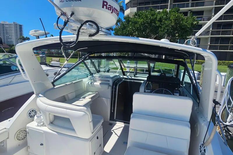 Slide: The Image of 2001 Tiara Yachts 3100 Open boat interior with white seating and navigation equipment. - 16