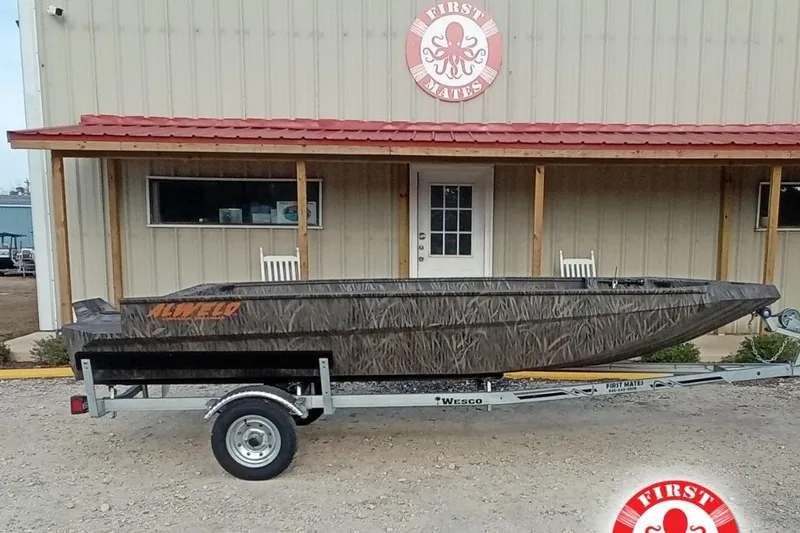 The Image of 2026 Alweld 1652 Invader boat on trailer outside First Mates building. - 2