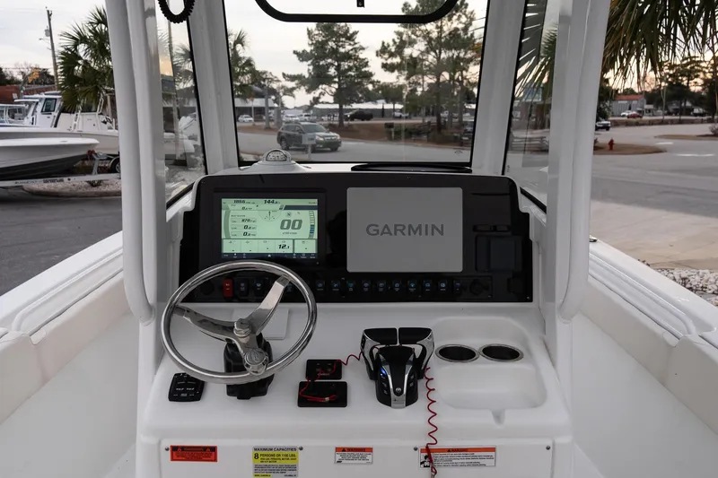 Slide: The Image of 2023 Sea Hunt Gamefish 25 boat dashboard with Garmin navigation system. - 12