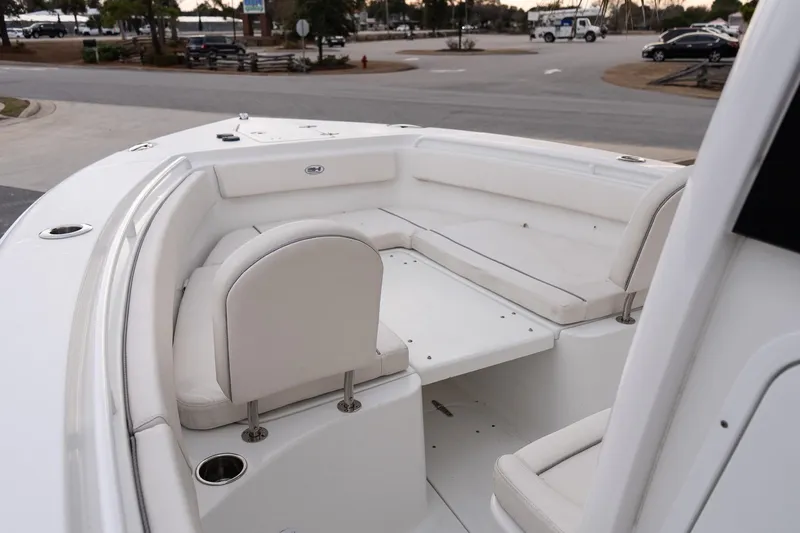 Slide: The Image of 2023 Sea Hunt Gamefish 25 boat interior with white cushioned seating. - 15