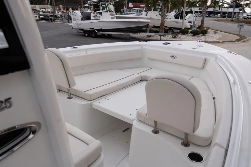 Slide: The Image of 2023 Sea Hunt Gamefish 25 boat interior with white seating and spacious layout. - 16