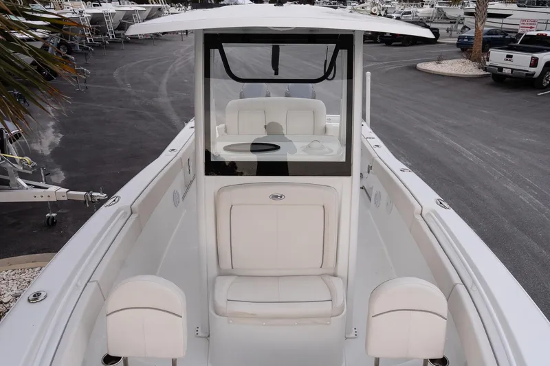 Slide: The Image of 2023 Sea Hunt Gamefish 25 boat interior with white seating and console. - 17