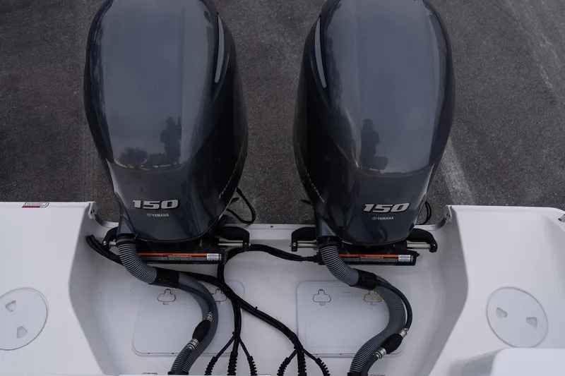 Slide: The Image of Twin Yamaha 150 engines on 2023 Sea Hunt Gamefish 25 boat. - 19
