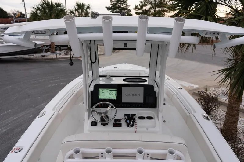 Slide: The Image of 2023 Sea Hunt Gamefish 25 boat console with Garmin display and rod holders. - 21