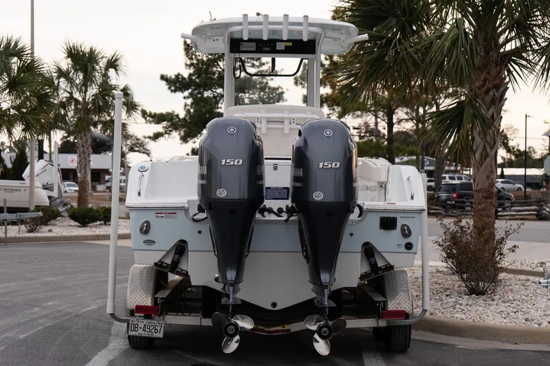 Slide: The Image of 2023 Sea Hunt Gamefish 25 boat with dual Yamaha 150 engines on a trailer. - 5