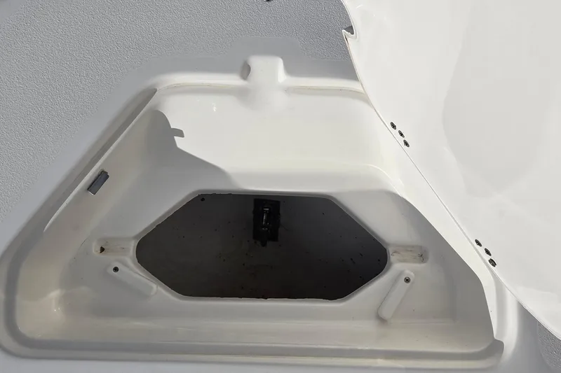 Slide: The Image of Open storage compartment on a 2018 Key West 219 FS boat. - 12