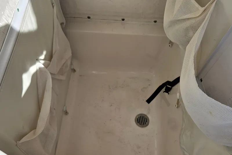 Slide: The Image of Interior view of a 2018 Key West 219 FS boat compartment with storage nets. - 5