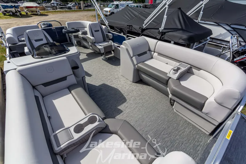 Slide: The Image of 2024 Godfrey Sweetwater 2286 SBX pontoon boat interior with plush seating and cup holders. - 10