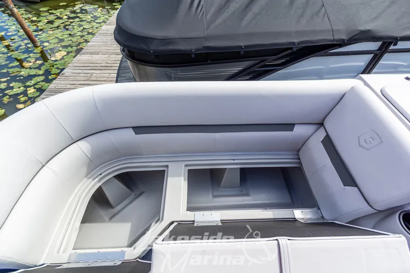 Slide: The Image of 2024 Godfrey Sweetwater 2286 SBX boat interior with open storage compartments. - 12