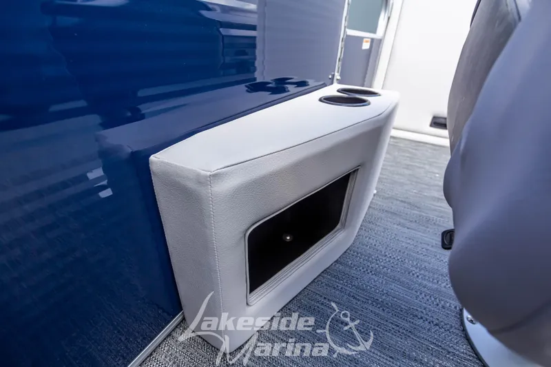 Slide: The Image of Interior of 2024 Godfrey Sweetwater 2286 SBX boat with cup holders and storage compartment. - 17