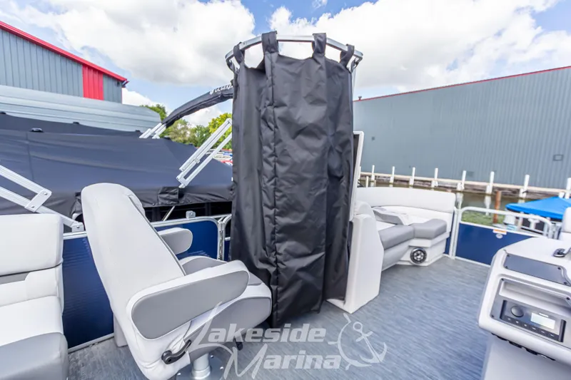 Slide: The Image of 2024 Godfrey Sweetwater 2286 SBX pontoon boat interior with seating and privacy curtain. - 18
