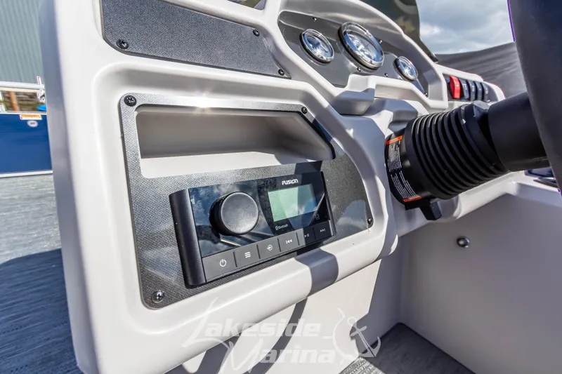 Slide: The Image of 2024 Godfrey Sweetwater 2286 SBX dashboard with Fusion audio system and controls. - 23