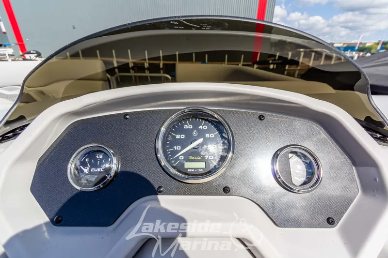 Slide: The Image of Dashboard of 2024 Godfrey Sweetwater 2286 SBX boat with gauges and controls. - 24